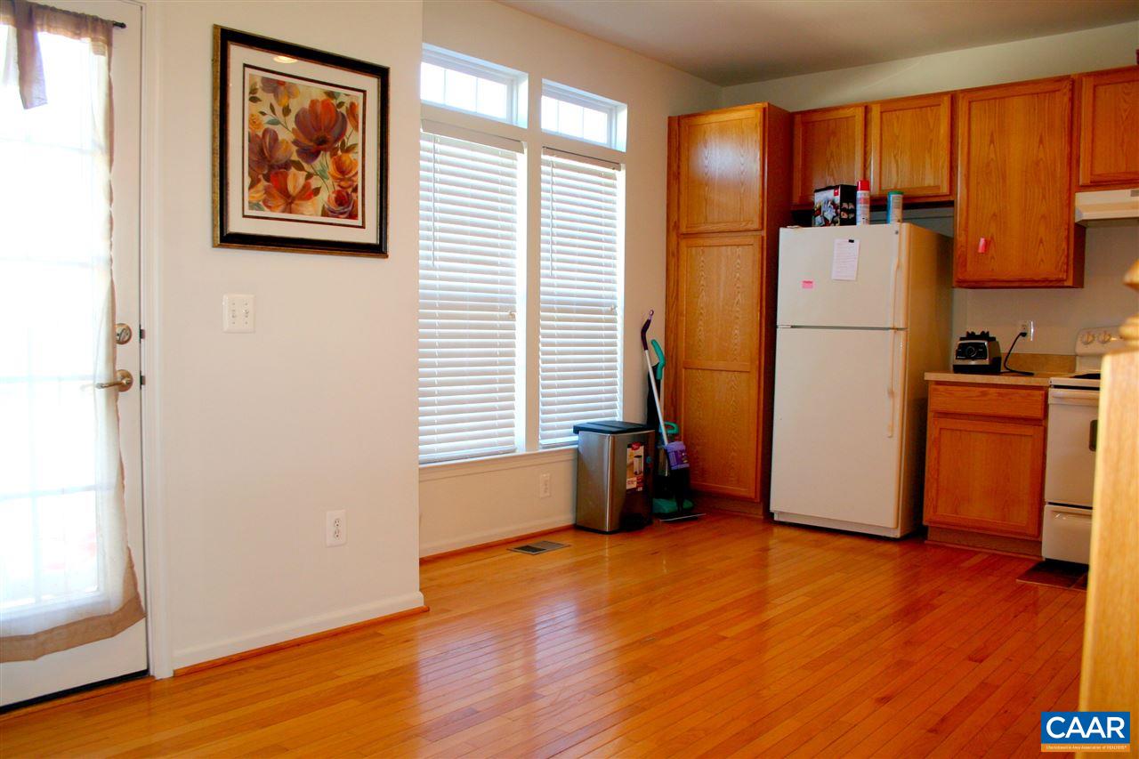 323 Rolkin Road Charlottesville, VA 22911 - Photo 4 of 47 an empty room with wooden floor and a window