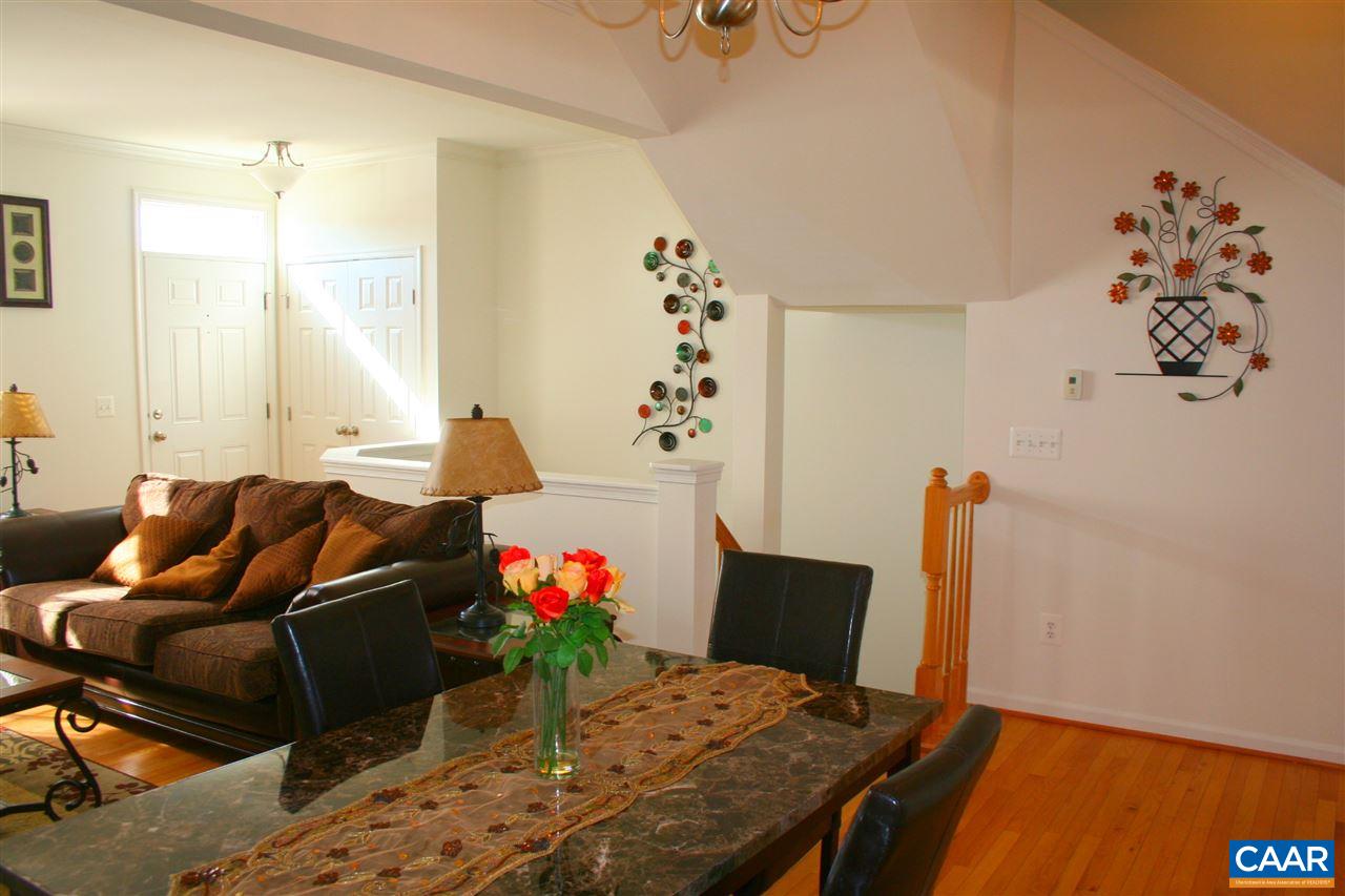 323 Rolkin Road Charlottesville, VA 22911 - Photo 8 of 47 a living room with furniture and flowers