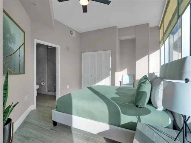 a bedroom with a bed and window