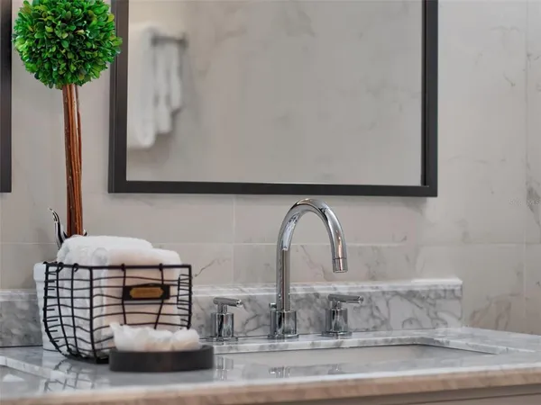 a bed room with a bed and a chair