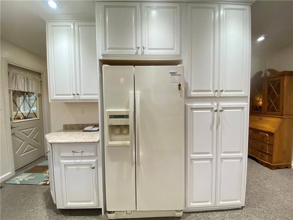 7 Lininger Road Greenville, PA 16125 - Photo 18 of 48 a kitchen with white cabinets and refrigerator