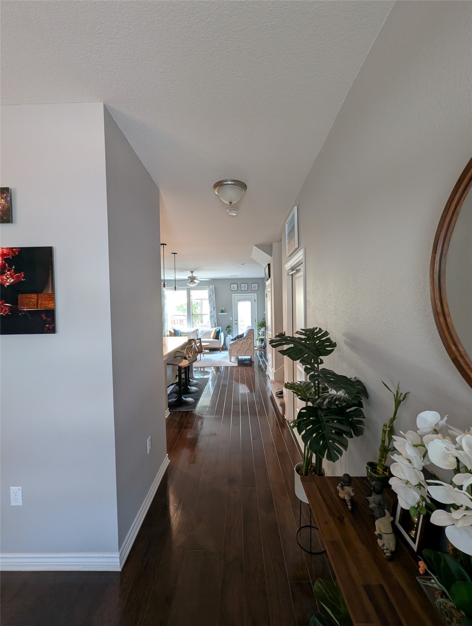 14502 McCoy Loop Austin, TX 78717 - Photo 10 of 26 Hallway with dark wood-finish flooring extending into the background