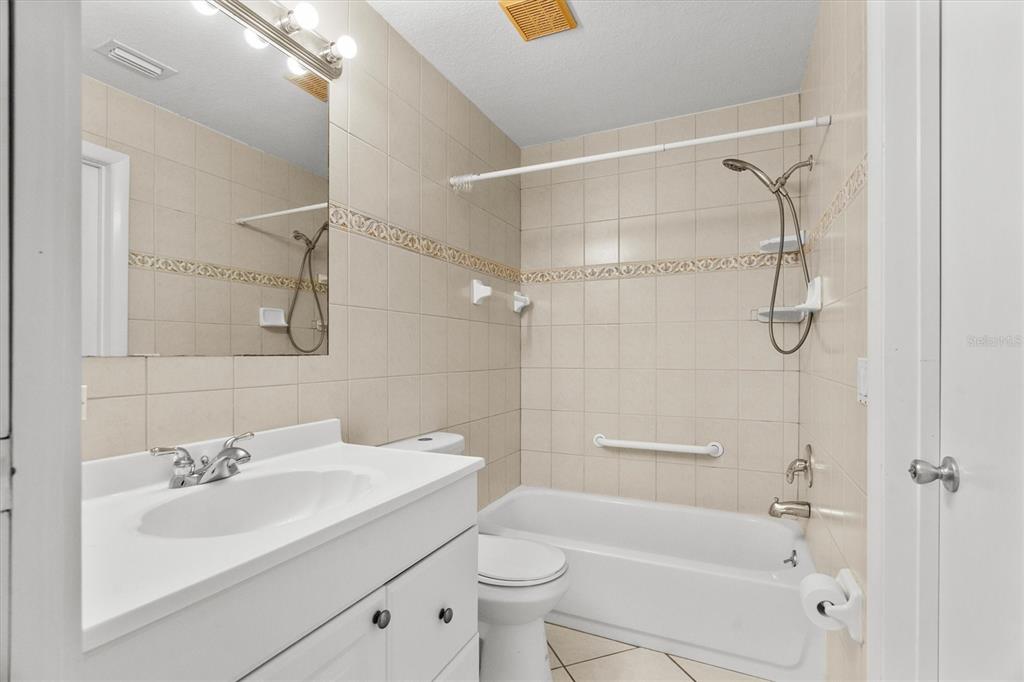 2660 Lear Road Englewood, FL 34224 - Photo 16 of 42 a bathroom with a sink toilet and shower