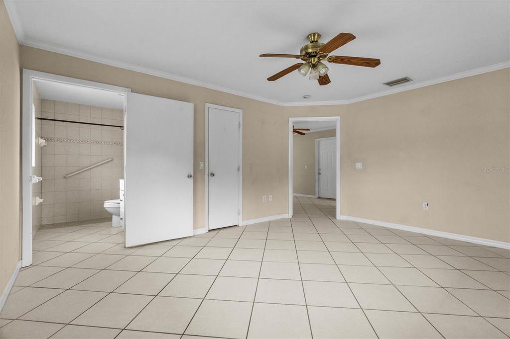 2660 Lear Road Englewood, FL 34224 - Photo 28 of 42 a view of an empty room and chandelier fan