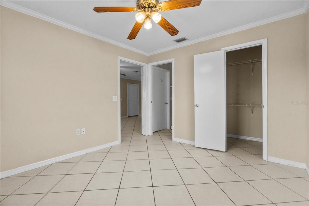 2660 Lear Road Englewood, FL 34224 - Photo 31 of 42 a view of an empty room and chandelier fan
