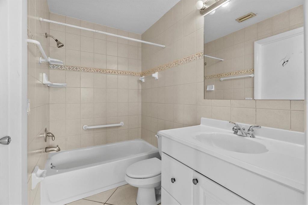 2660 Lear Road Englewood, FL 34224 - Photo 32 of 42 a bathroom with a sink a toilet and shower