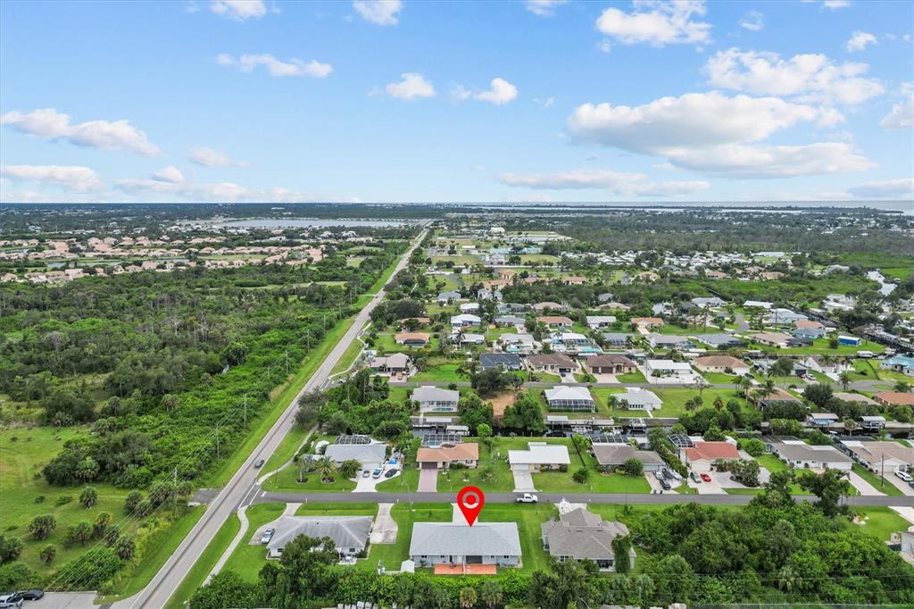 2660 Lear Road Englewood, FL 34224 - Photo 41 of 42 an aerial view of residential houses with outdoor space and trees