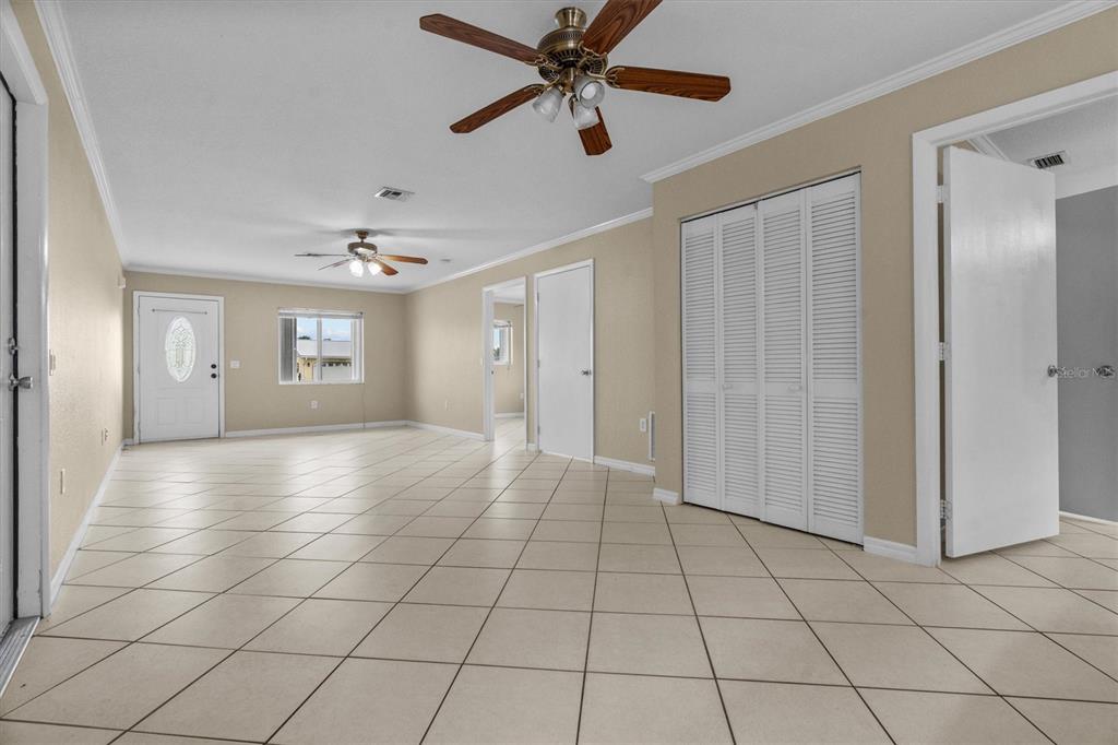 2660 Lear Road Englewood, FL 34224 - Photo 8 of 42 a view of a livingroom with a chandelier fan and windows