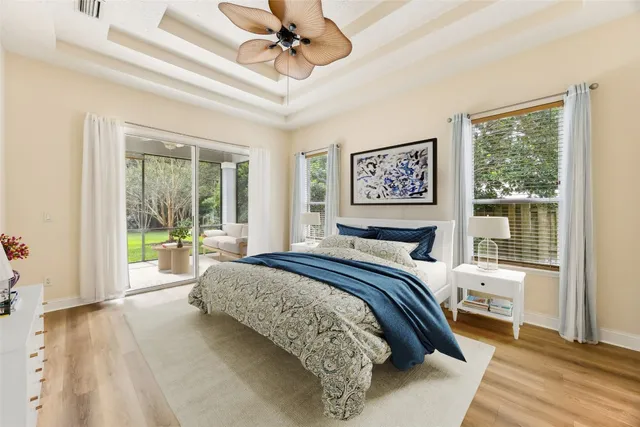 a bedroom with a large bed and a window