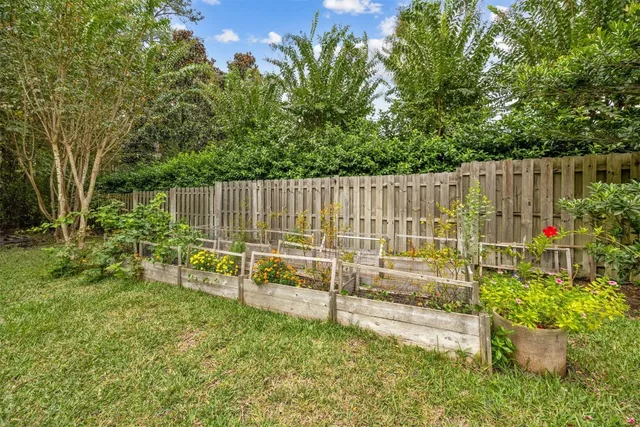a view of yard with swimming pool and sitting area
