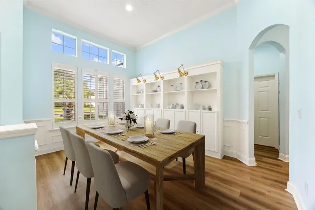 a view of a dining room with furniture window and wooden floor