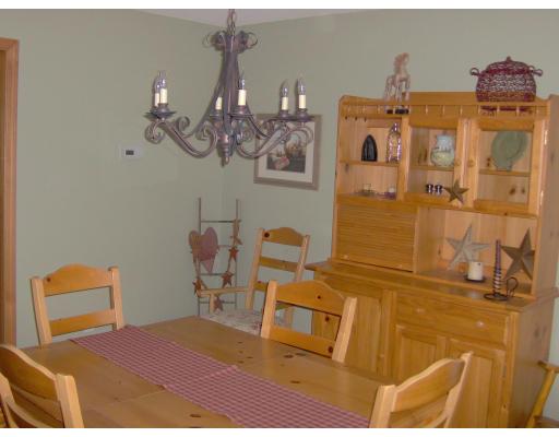 3134 Boston Road Wilbraham, MA 01095 - Photo 3 of 19 a bedroom with a bed and chandelier