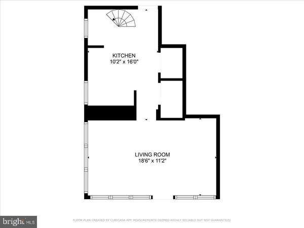 a picture of a bench in front of a wall