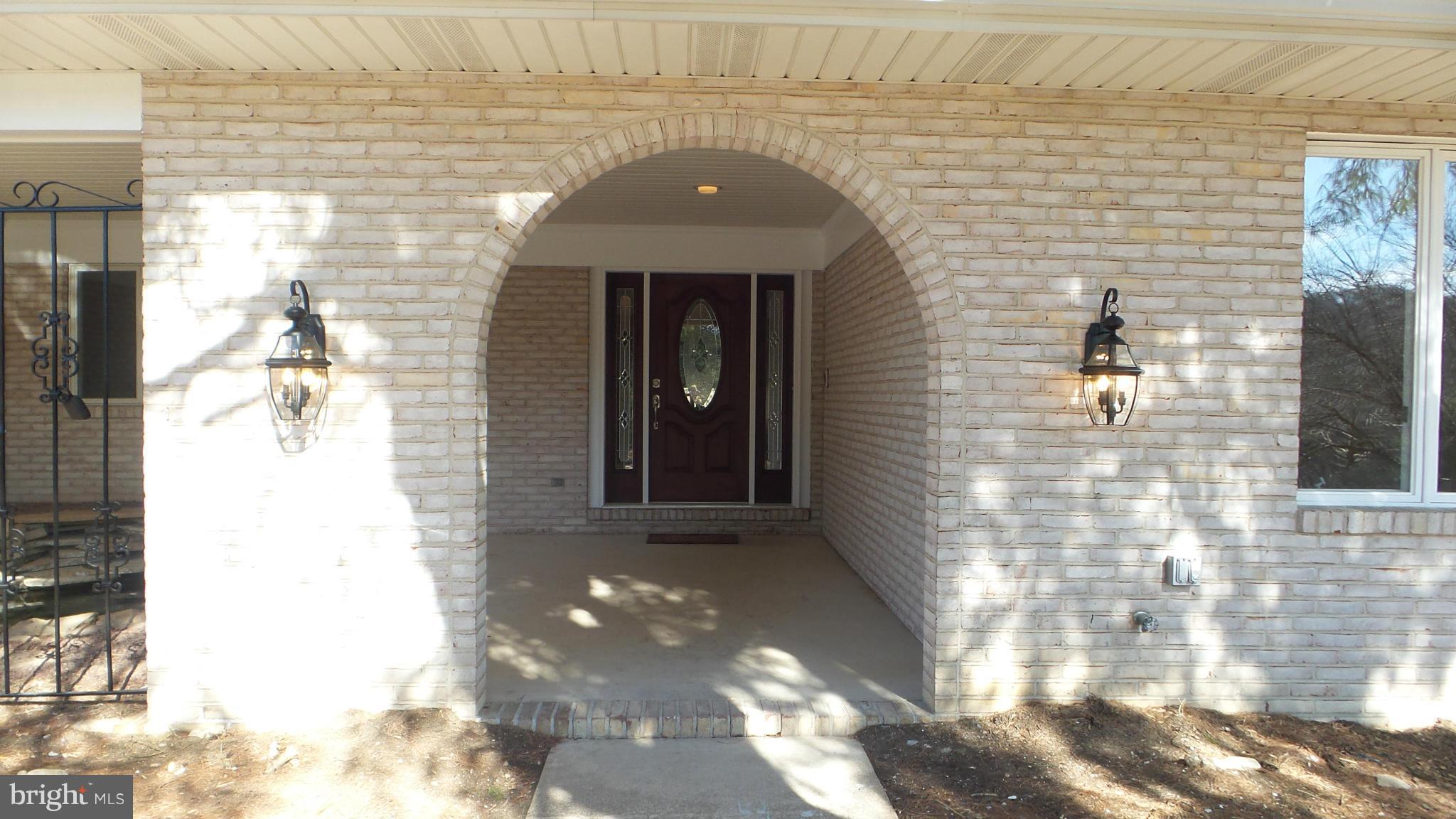 13409 Bladon Road Phoenix, MD 21131 - Photo 2 of 27 a front view of a house with a yard