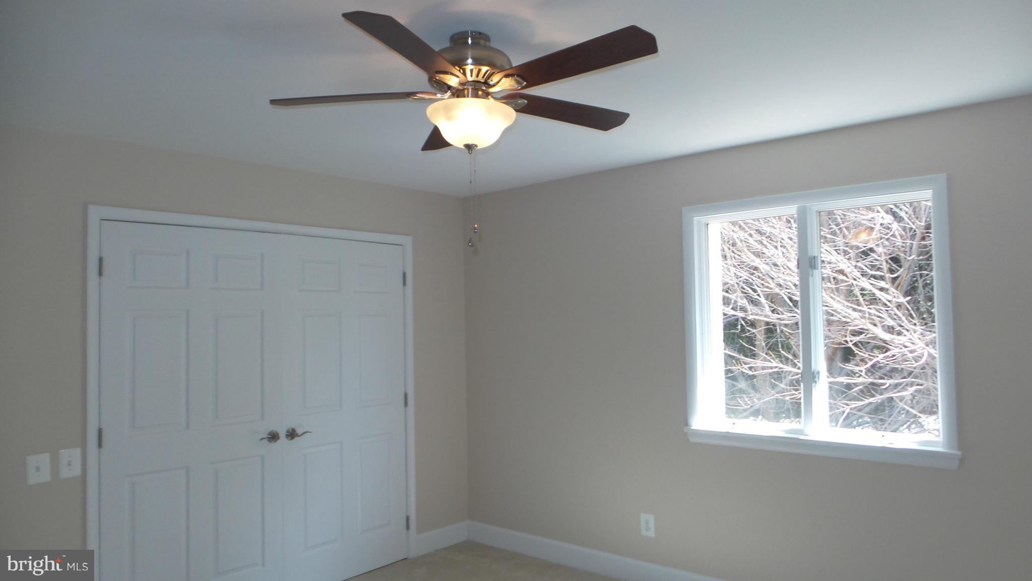 13409 Bladon Road Phoenix, MD 21131 - Photo 14 of 27 an empty room with windows and fan