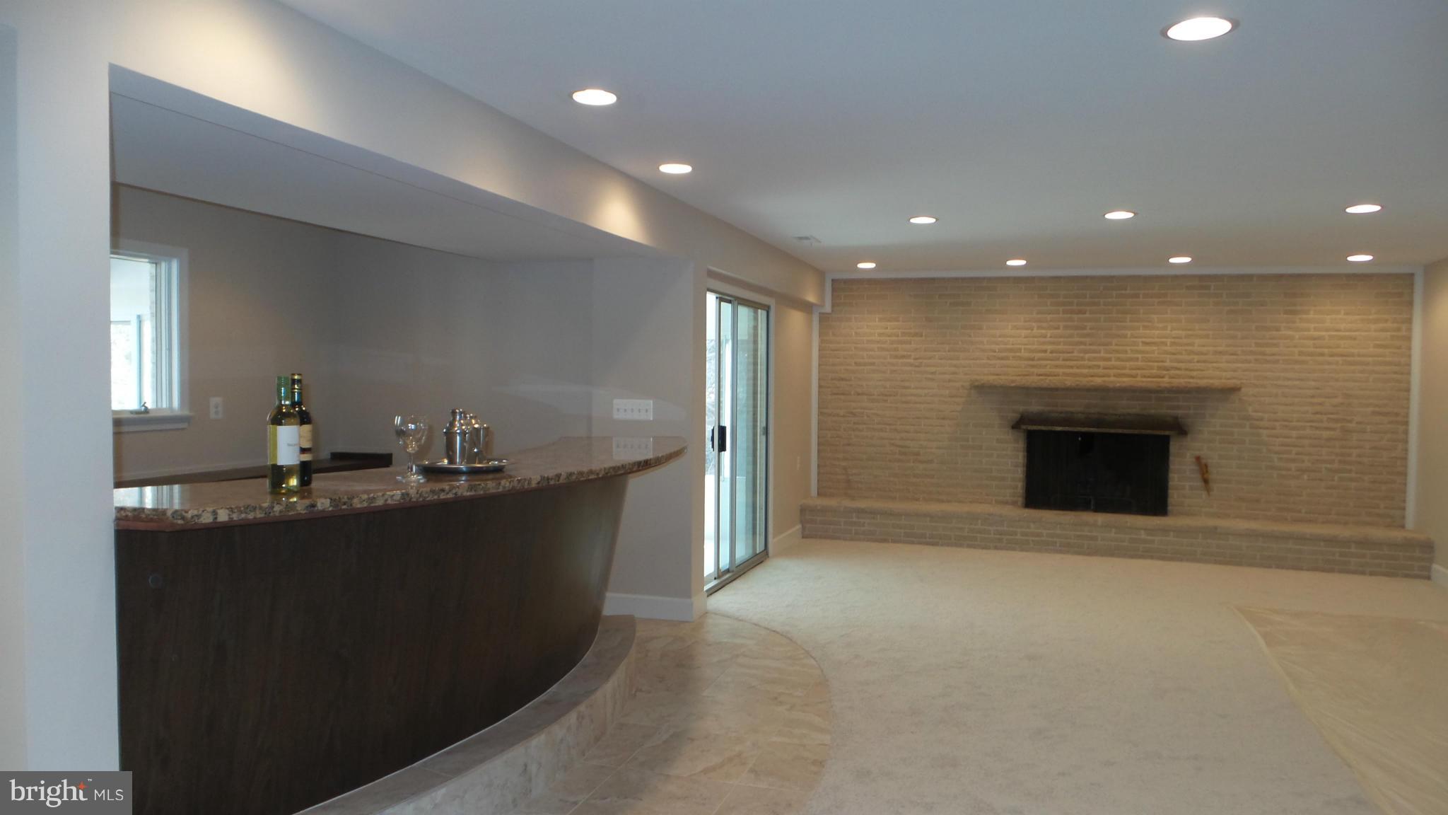 13409 Bladon Road Phoenix, MD 21131 - Photo 16 of 27 a view of a kitchen with a sink and a fireplace