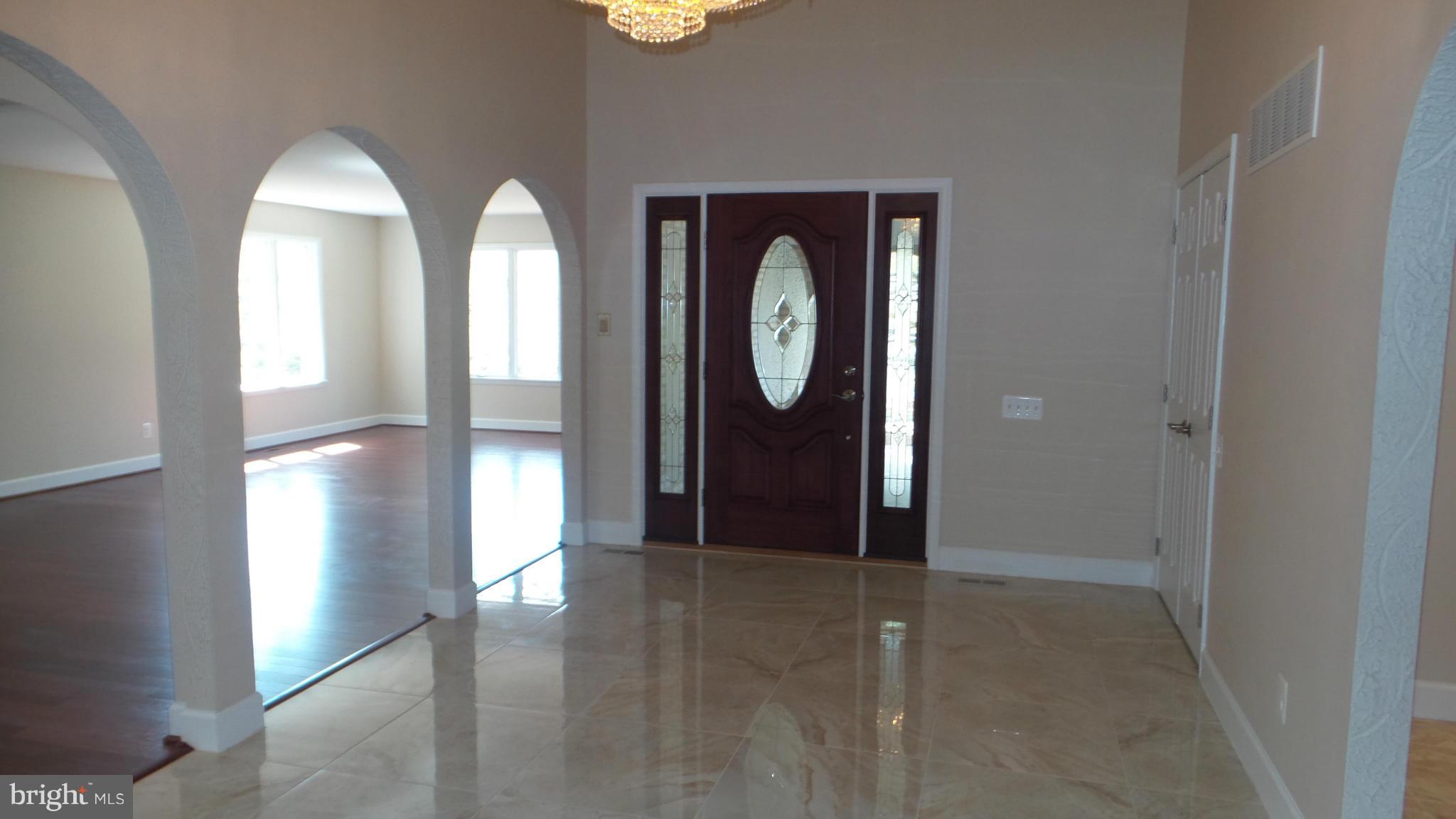 13409 Bladon Road Phoenix, MD 21131 - Photo 3 of 27 a view of a entryway door with wooden floor