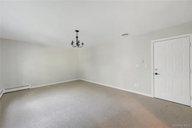 an empty room with a empty space and a window