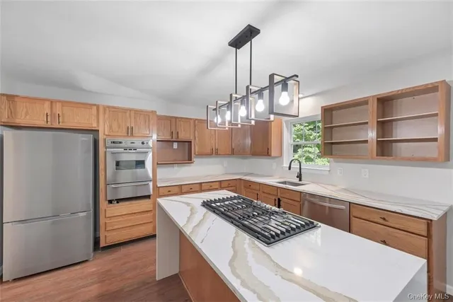 a kitchen with refrigerator and cabinets