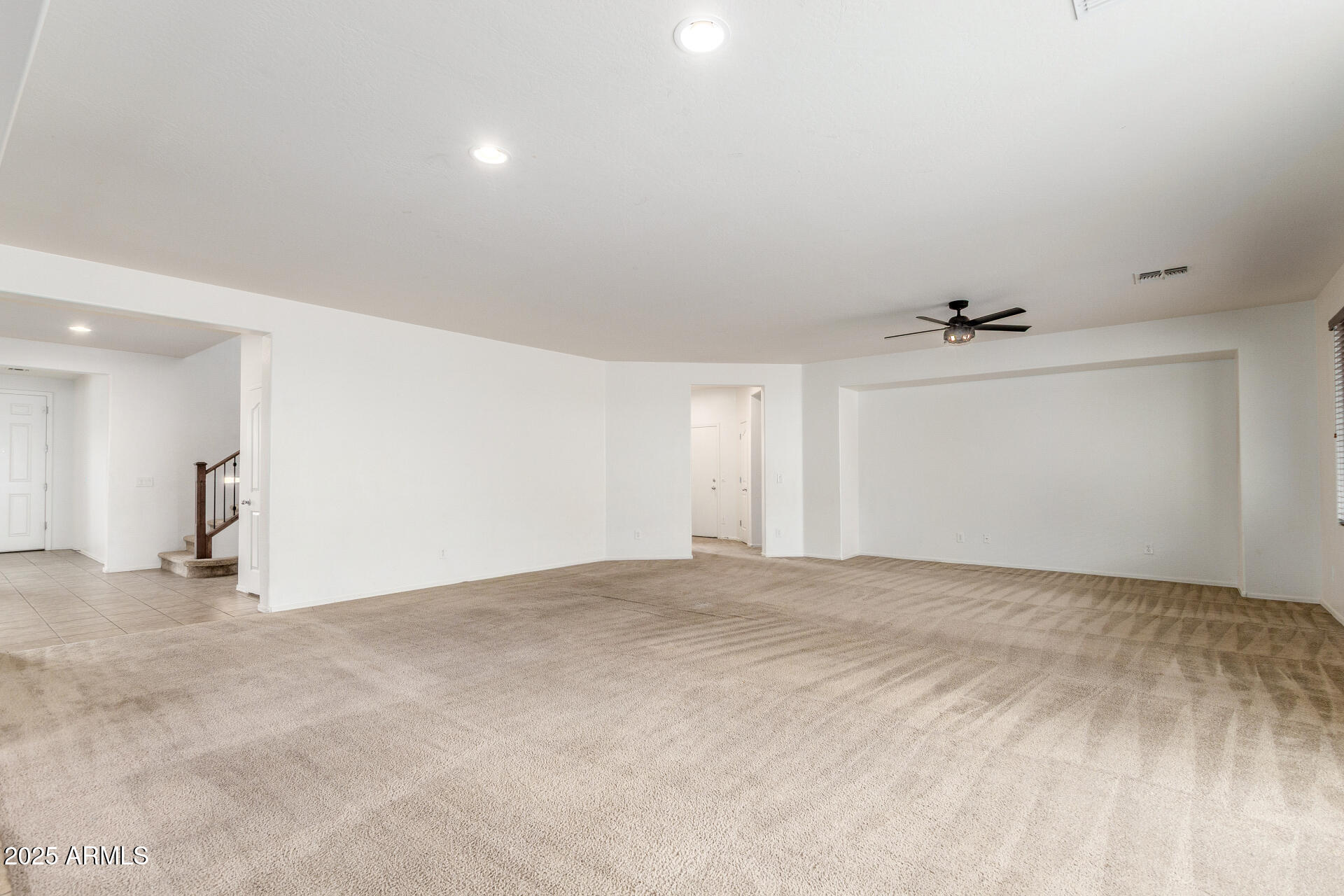 20932 Vía De Arboles Queen Creek, AZ 85142 - Photo 12 of 58 a view of an empty room with a window