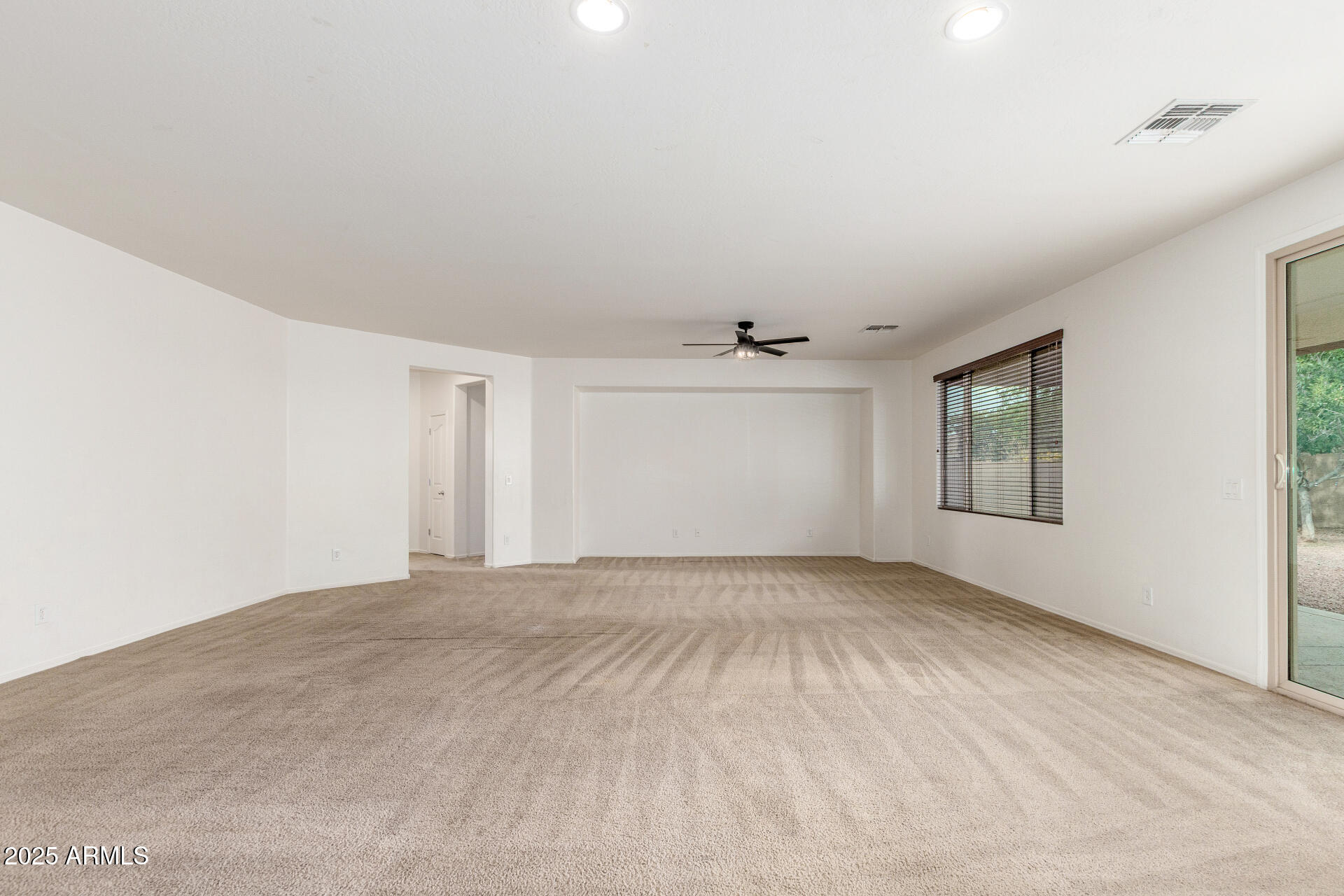 20932 Vía De Arboles Queen Creek, AZ 85142 - Photo 13 of 58 a view of an empty room with a window