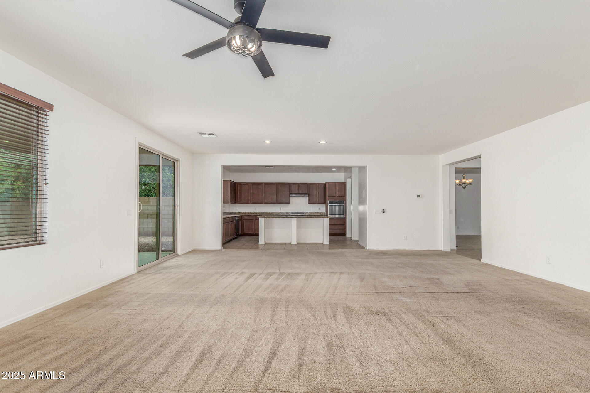 20932 Vía De Arboles Queen Creek, AZ 85142 - Photo 15 of 58 a view of an empty room with a window