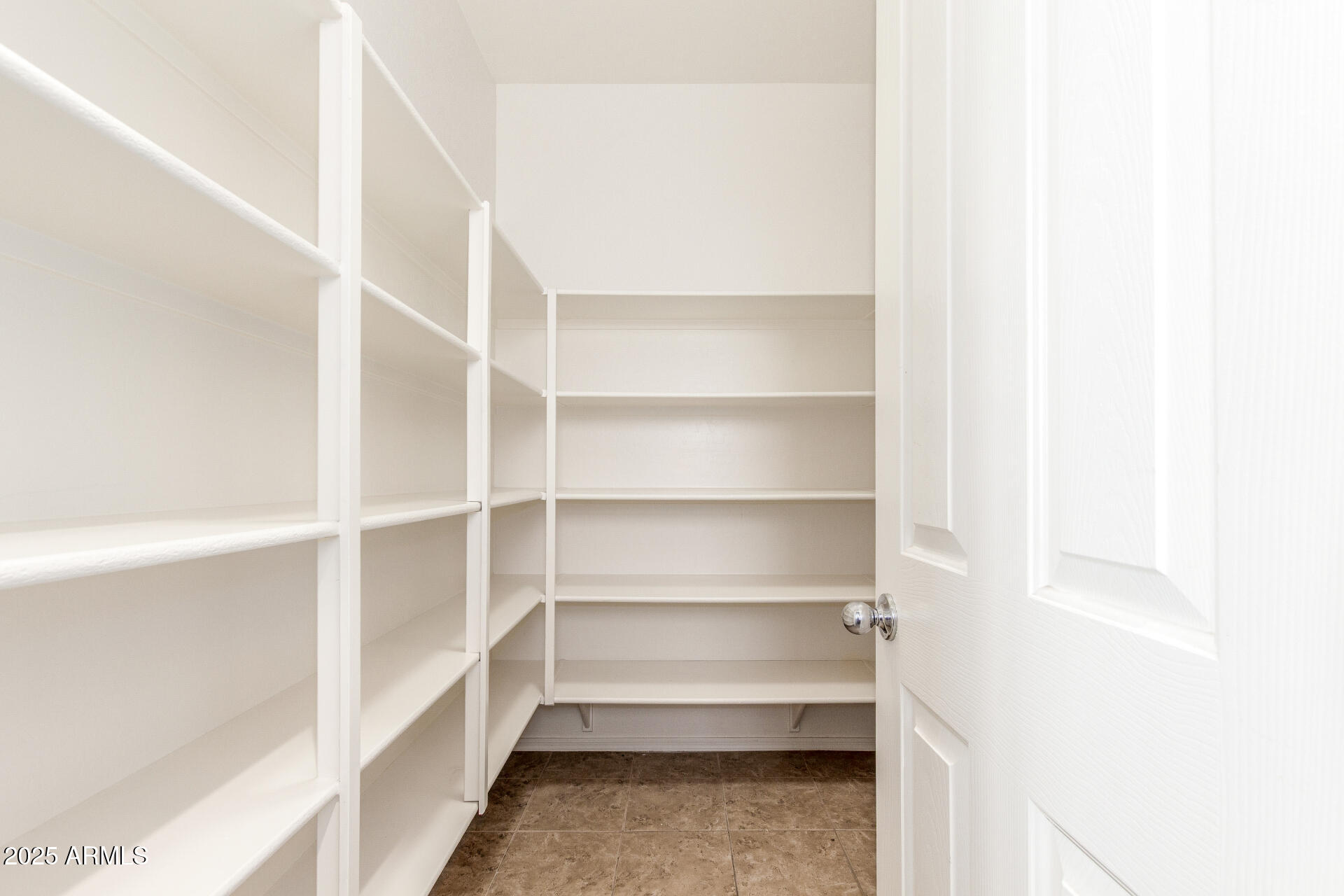 20932 Vía De Arboles Queen Creek, AZ 85142 - Photo 23 of 58 a view of walk in closet with empty racks