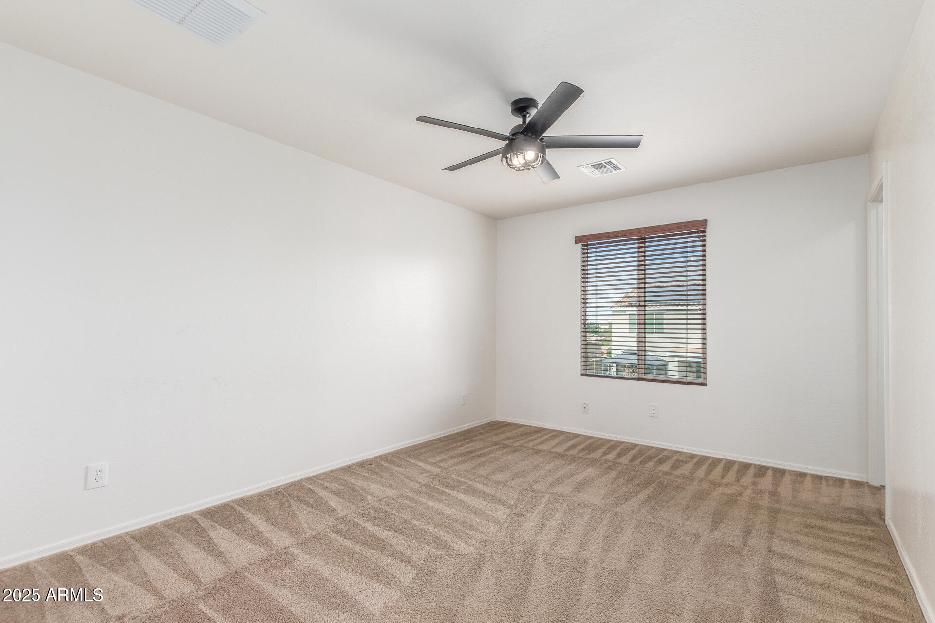 20932 Vía De Arboles Queen Creek, AZ 85142 - Photo 36 of 58 a view of an empty room with a window