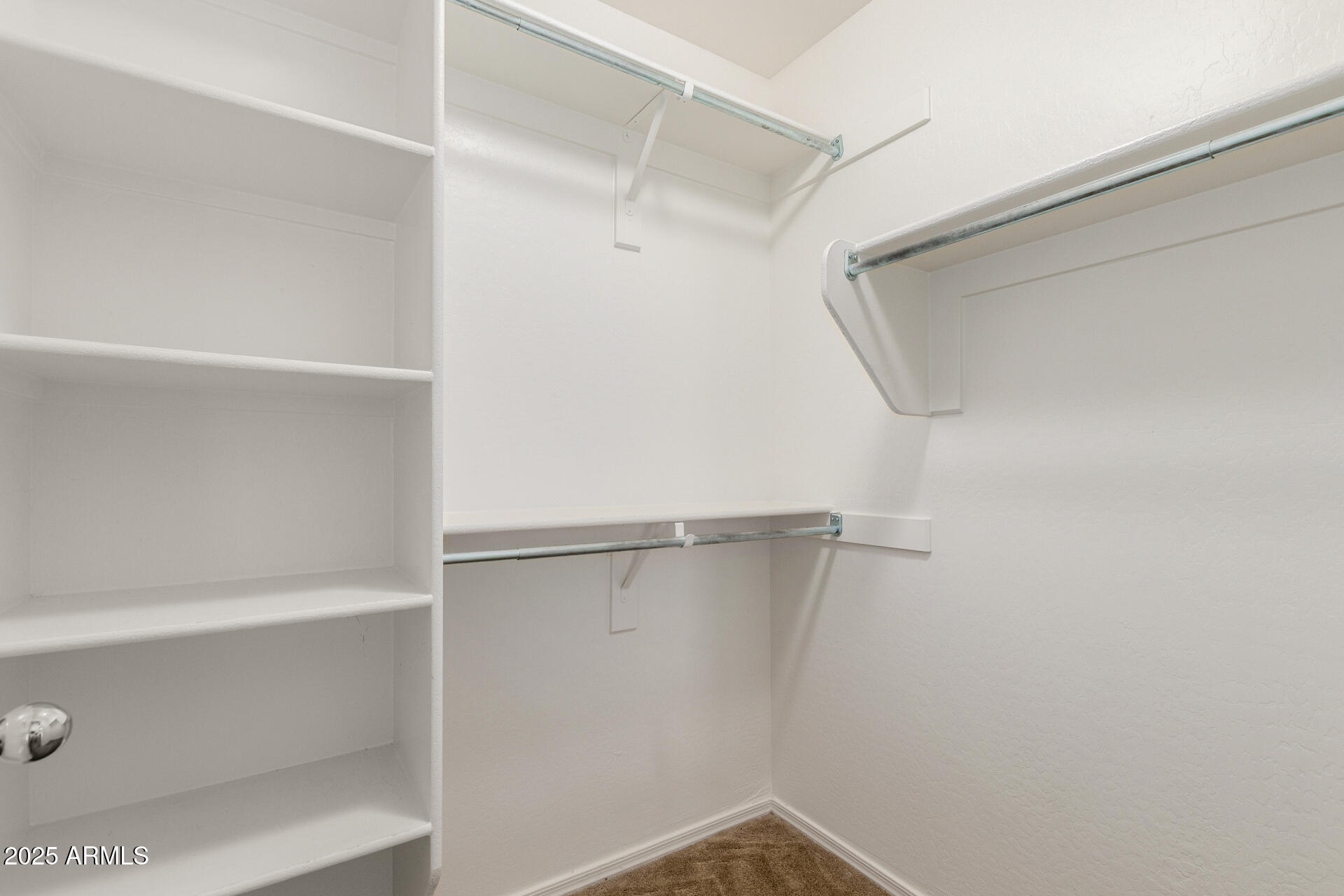 20932 Vía De Arboles Queen Creek, AZ 85142 - Photo 38 of 58 a view of a room with racks on the wall