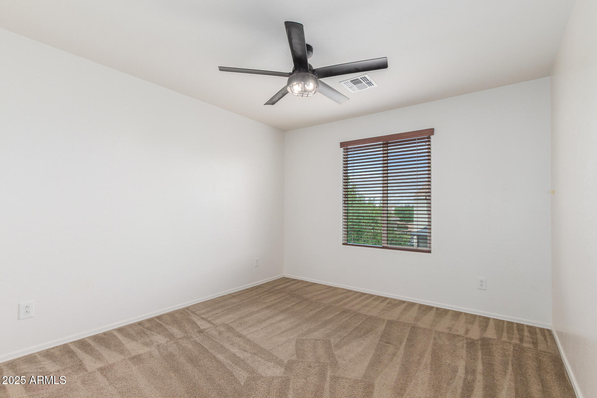 20932 Vía De Arboles Queen Creek, AZ 85142 - Photo 39 of 58 a view of a big room with windows and ceiling fan