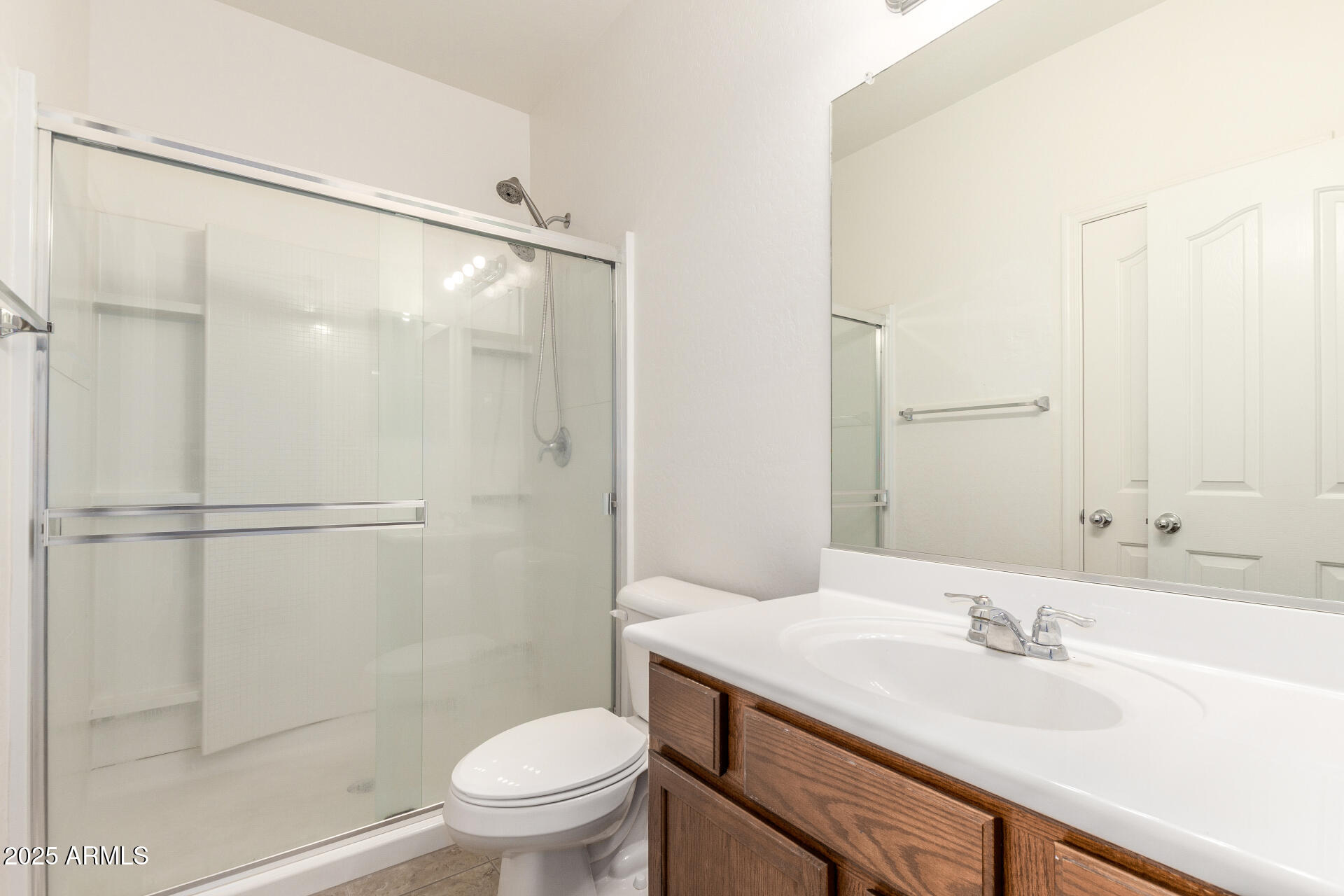20932 Vía De Arboles Queen Creek, AZ 85142 - Photo 45 of 58 a bathroom with a sink a toilet and a mirror