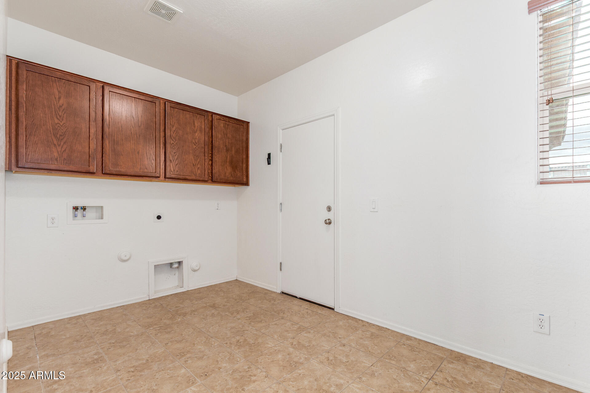 20932 Vía De Arboles Queen Creek, AZ 85142 - Photo 50 of 58 a view of a room with cabinets