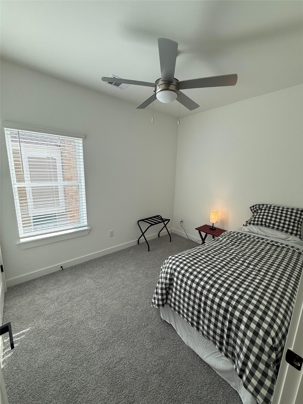 11621 Waldemar Drive Houston, TX 77077 - Photo 12 of 17 a bedroom with bed and window