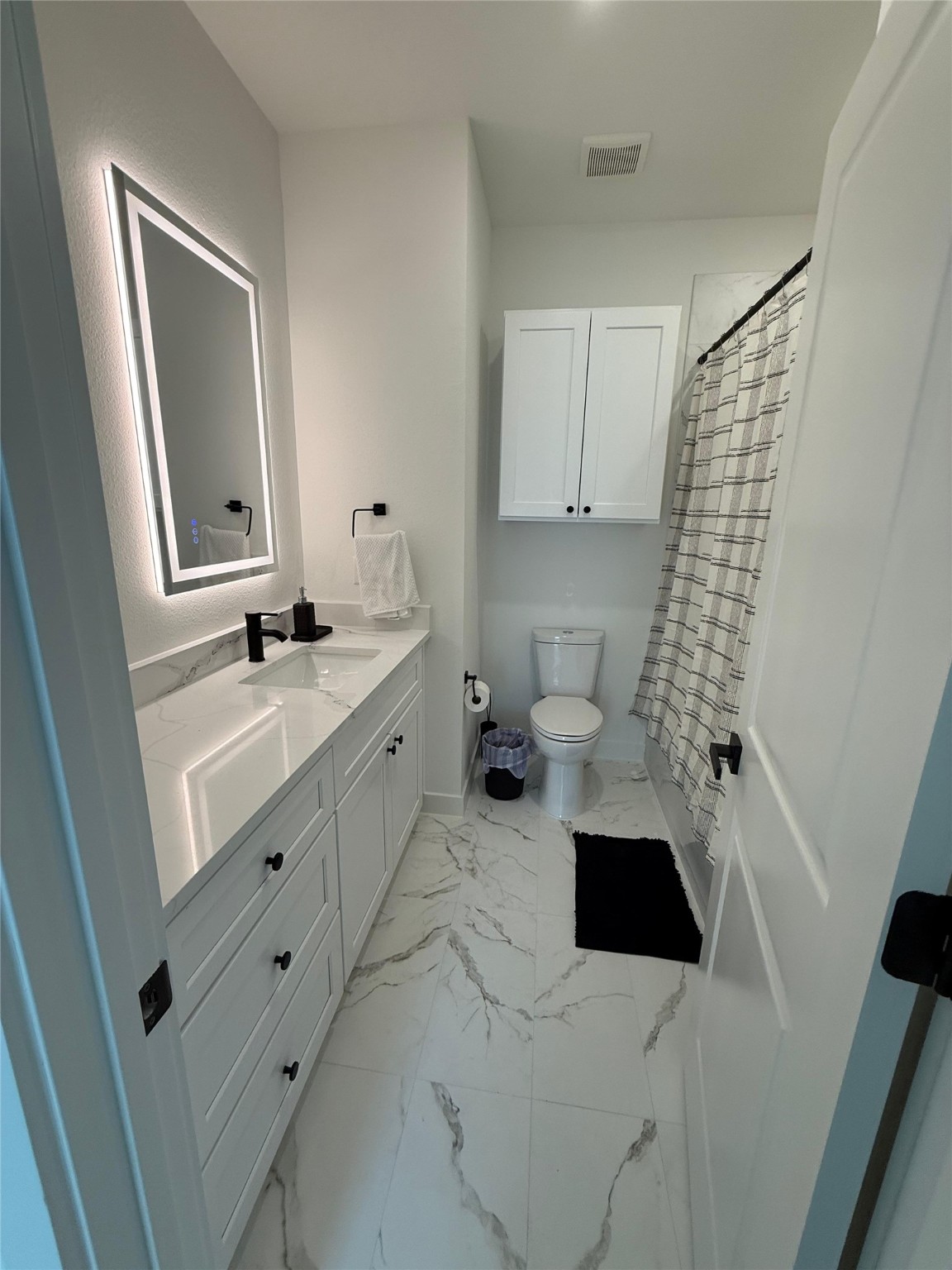 11621 Waldemar Drive Houston, TX 77077 - Photo 14 of 17 a bathroom with a sink toilet and shower