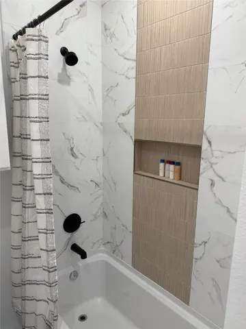 a bathroom with a bathtub