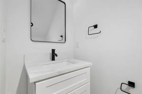 a bathroom with a sink and mirror
