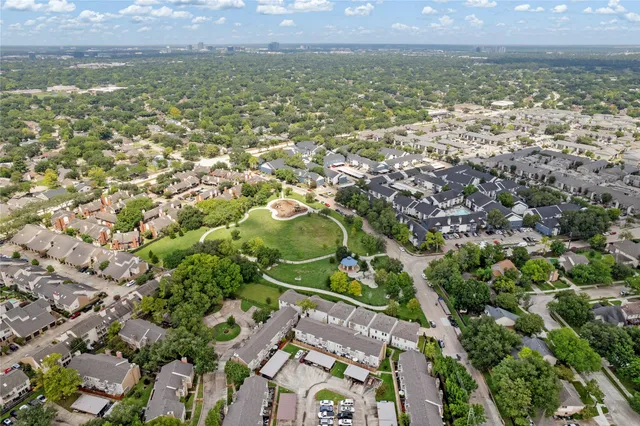 an aerial view of residential building and green space