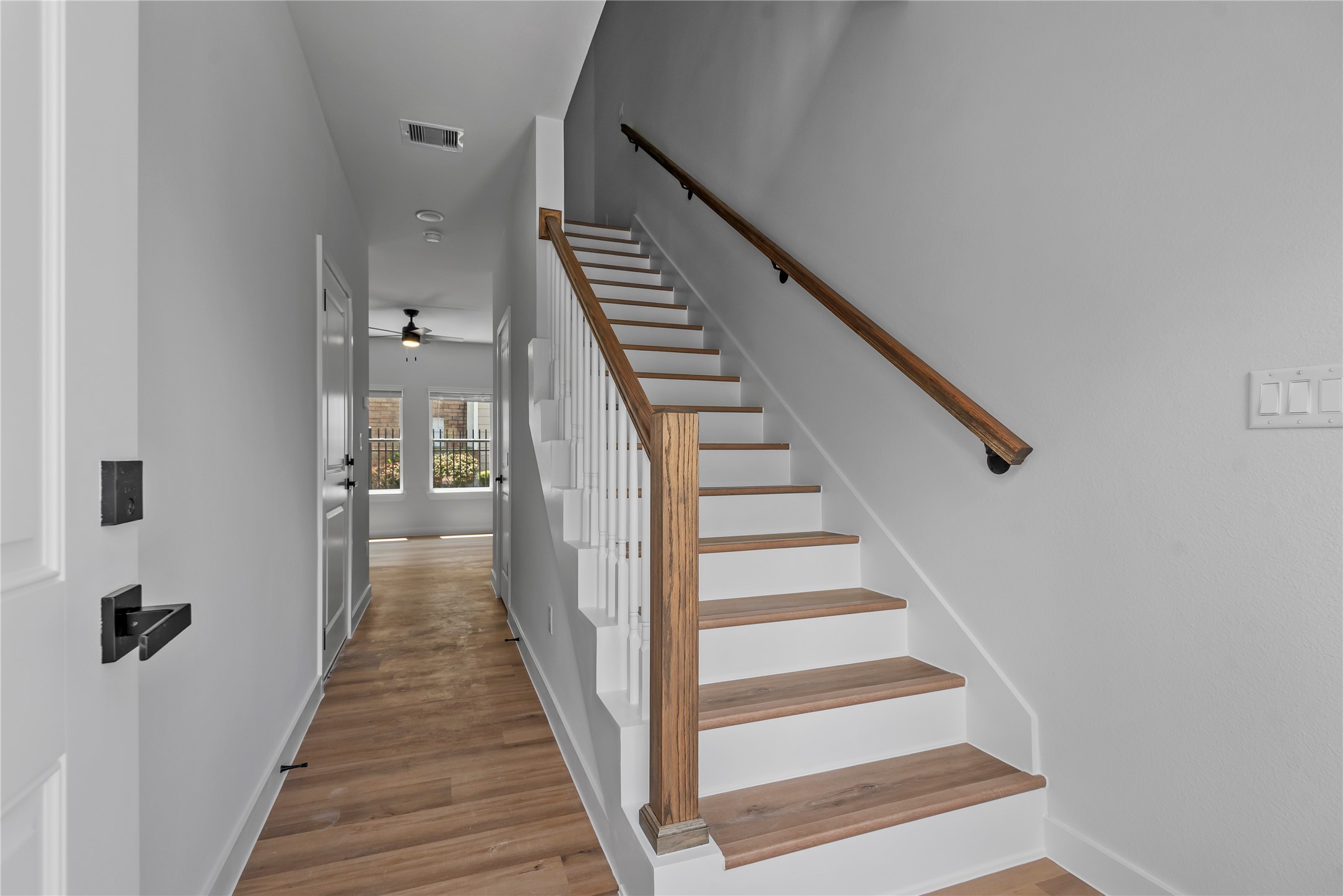 11621 Waldemar Drive Houston, TX 77077 - Photo 2 of 17 a view of a hallway with wooden floor and entryway
