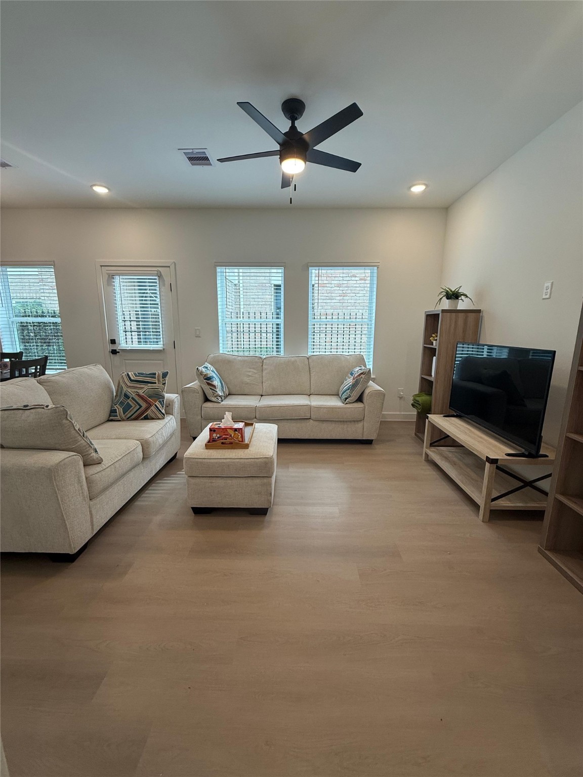 11621 Waldemar Drive Houston, TX 77077 - Photo 3 of 17 a living room with furniture and a ceiling fan