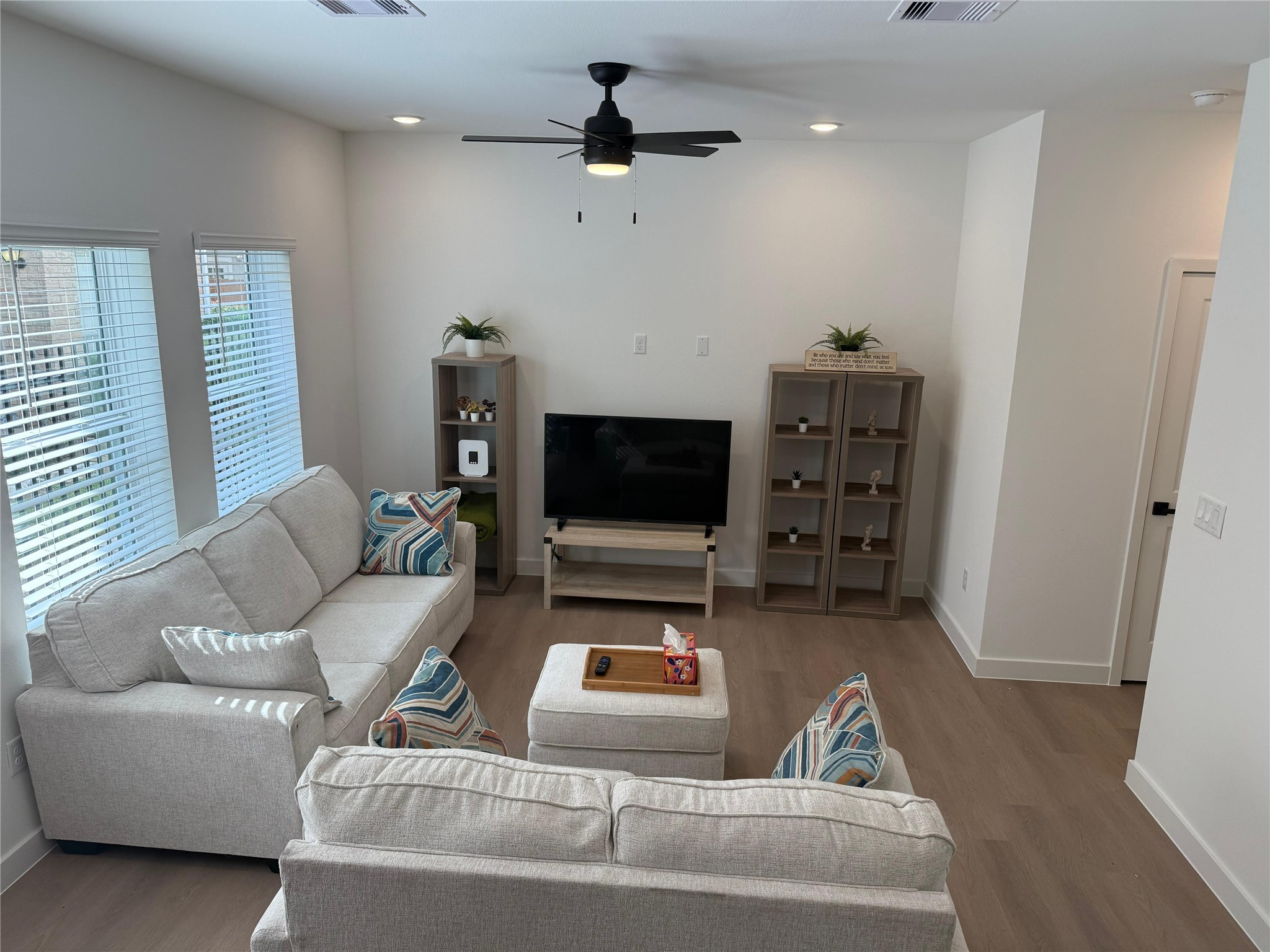 11621 Waldemar Drive Houston, TX 77077 - Photo 4 of 17 a living room with furniture and a flat screen tv