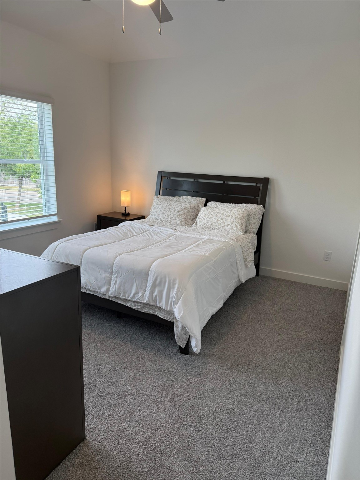 11621 Waldemar Drive Houston, TX 77077 - Photo 9 of 17 a bedroom with bed and window