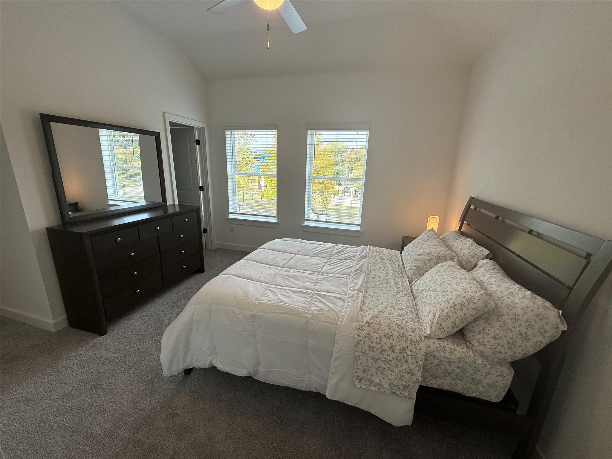 11621 Waldemar Drive Houston, TX 77077 - Photo 10 of 17 a bedroom with a bed and window