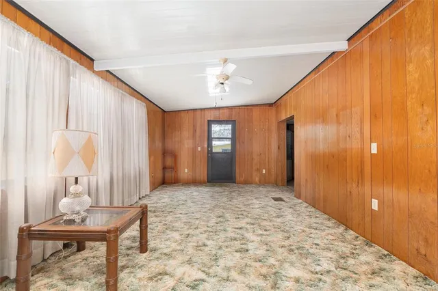 a wooden fence with trees in the background