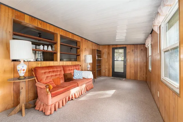 a kitchen with stainless steel appliances a stove a refrigerator a oven with white cabinets and wooden floor