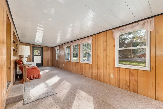 a kitchen with white cabinets and white stainless steel appliances