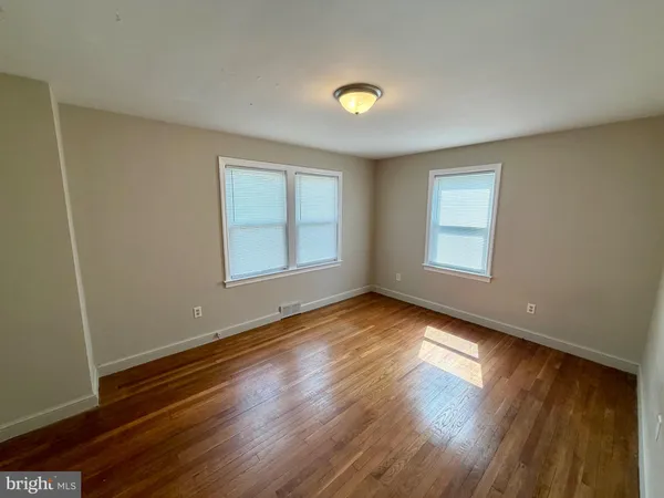 a view of wooden floor in an empty room