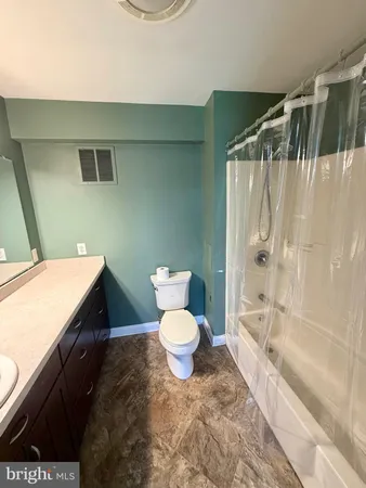 a view of a room with air conditioner and windows
