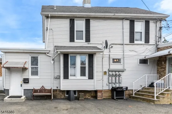 a view of a house with a parking space