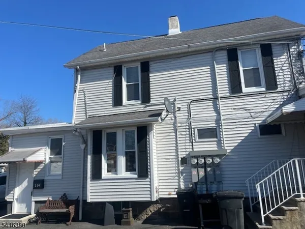 a view of a house with more windows and deck
