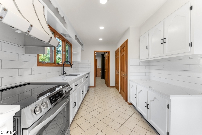 59 Cherryville Stanton Road Flemington, NJ 08822 - Photo 14 of 31 a kitchen with stainless steel appliances granite countertop a sink and a stove